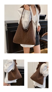 Detail view showing large leopard print hobo bag with matte finish and dark brown strap