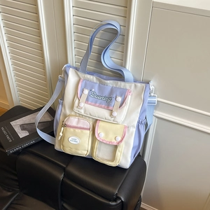 Multicolor pastel patchwork tote bag with adjustable strap and multiple front pockets