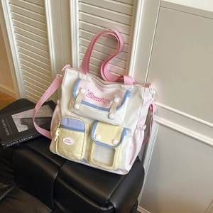 Chic canvas bucket bag with multi-color pockets and cross-body strap for daily use