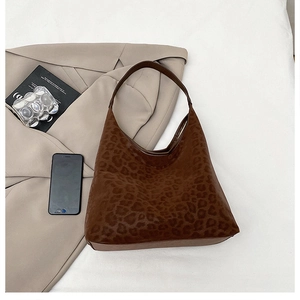 Detailed view of leopard print hobo tote bag with brown textures and large capacity