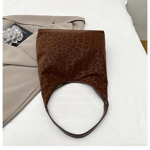 Detail of hobo shoulder bag with brown leopard print and soft suede texture finish
