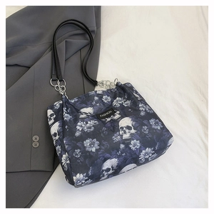 Detail of floral skull print tote bag with metal chain strap and FASHION tag