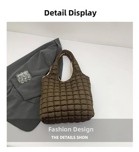 Close-up of brown quilted tote bag showing detailed puff stitch and soft fabric texture