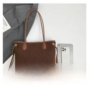 Brown fleece tote bag showing large capacity compared with a tablet and phone