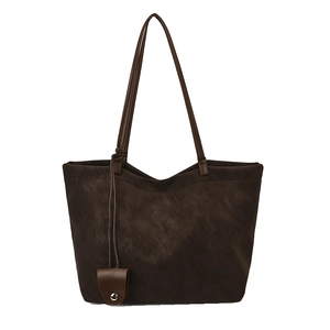 Minimalist deep brown tote bag in matte leather finish with slim shoulder straps