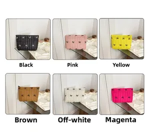 Quilted cosmetic bags with bow embroidery shown in six colors including pink and black