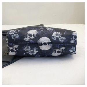 Detail of gothic floral skull pattern on large tote bag base with premium stitching
