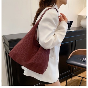 Detail of burgundy leopard print tote bag in soft suede-like texture for women