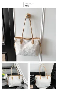 Detail of white sherpa tote bag with camel PU leather straps and side drawstring
