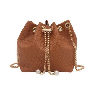 Caramel woven bucket bag with gold chain drawstring and pearl accents for women