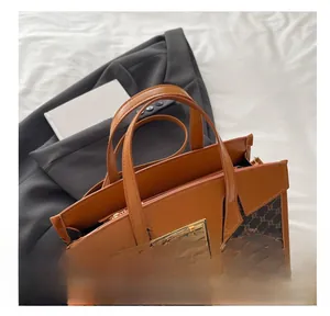 Close-up of the vintage brown monogram pattern handbag with a golden metallic lock