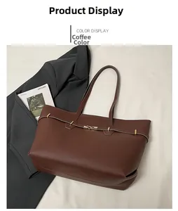 Flat lay of a coffee-colored vintage faux leather tote bag with elegant gold buckle detail