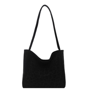 Minimalist large black tote bag with animal pattern and slim shoulder straps