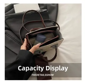 Interior view showing the large capacity and zipper pocket of the woven tote bag