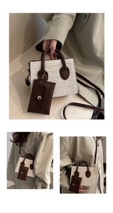 Detail of straw woven tote with brown leather trim and detachable card holder pouch