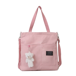 Pink canvas tote bag for women with bear pendant and adjustable shoulder strap