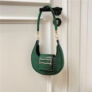 Dark green crescent shoulder bag with crocodile pattern and elegant gold buckle