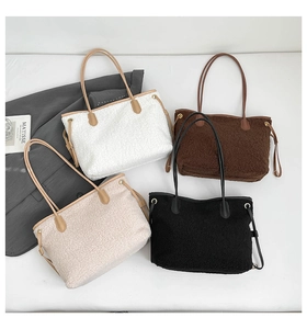 Flat lay of colorful plush tote bags with leather handles and side drawstring detail