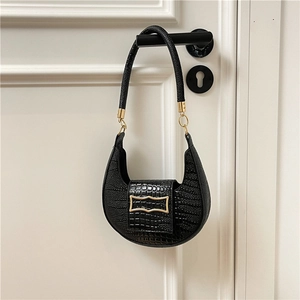 Fashionable black crescent shoulder bag with crocodile pattern and golden metal buckle