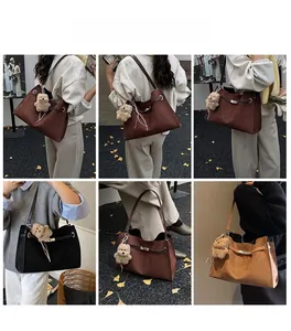 Detail showing multi-color suede tote bags with metal buckles and cute plush bear charms