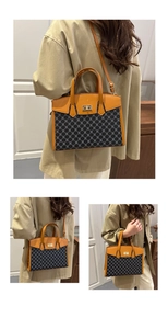 Detail of retro tote bag showing gold clasp, geometric pattern, and leather texture
