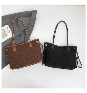 Detail of sherpa and leather contrast on brown and black tote bags with drawstring