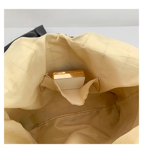 Detail view of the spacious inner compartment with a functional slip pocket and smooth lining