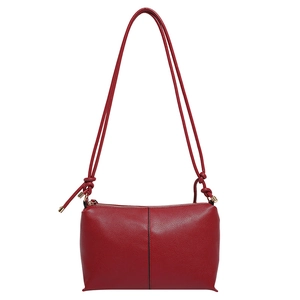 Minimalist red leather shoulder bag with pebbled texture and central seam detail