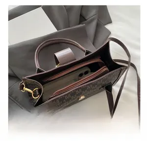 Top view of brown jacquard tote bag interior showing spacious capacity for smartphones
