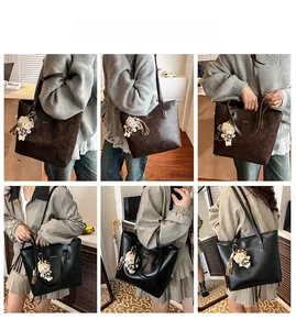 Detailed views of the large leather tote bag featuring a cute leopard cat charm accessory