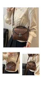 Detail of dark brown vintage faux leather handbag with silver clasp and adjustable strap