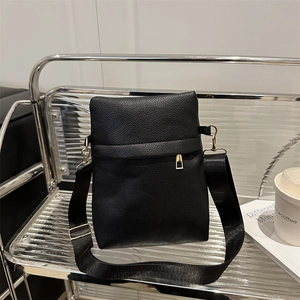 Chic black litchi pattern crossbody bag with golden hardware and wide nylon strap