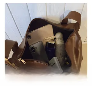 Top view of large brown leather tote bag interior showing spacious storage capacity