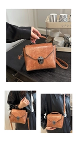Close-up of caramel brown retro handbag featuring vintage metal twist lock and leather texture