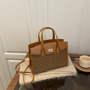 Classic retro brown monogram handbag with leather trim and gold metal twist lock