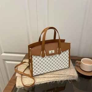 Chic monogram tote bag in white and brown with gold twist lock and adjustable strap