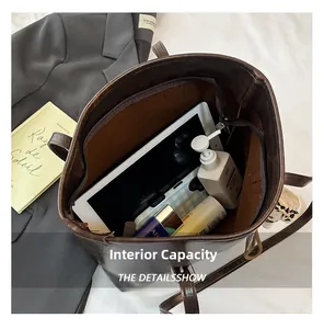 Interior view showing the large capacity and storage pockets of this brown tote bag