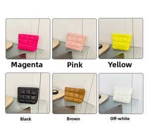 Quilted padded cosmetic bag in six solid colors shown on a display tray for organization