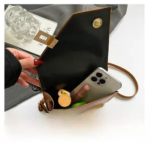 Detailed internal view showing the large capacity of the brown PU leather crossbody bag