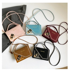 Five assorted mini crossbody bags in pastel and classic colors with contrast V-stitching