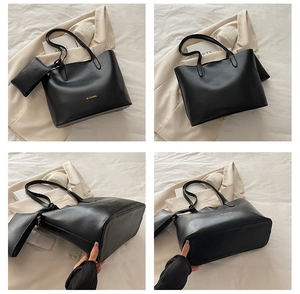 Detail view of black leather tote bag set with MS.XUXIBAG logo and inner pouch