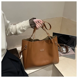 Caramel brown large tote bag in textured PU leather featuring versatile shoulder straps