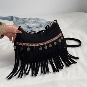 Bohemian black suede half-moon bag with tassels and vintage coin charms and shoulder strap