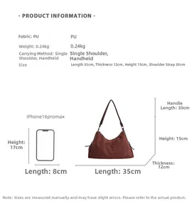 Size comparison of brown suede pillow bag with iPhone 16 Pro Max for scale