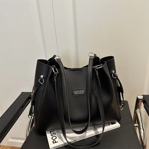 Modern black large capacity tote bag in premium faux leather for stylish daily commute