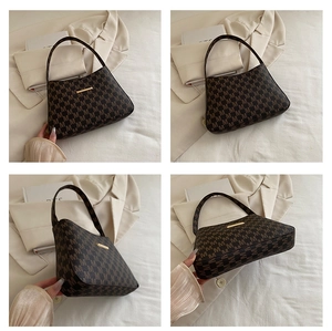 Four-angle view of vintage brown monogram handbag with elegant gold metal detail