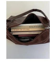 Detailed view of the large interior capacity of this brown vintage nubuck shoulder bag