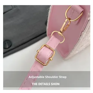 Detail of pink leather adjustable shoulder strap with premium gold metal buckle and hooks