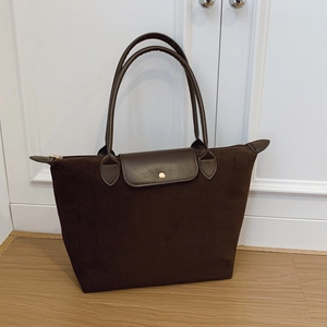 Large dark brown suede tote bag with leather handles and gold snap button closure