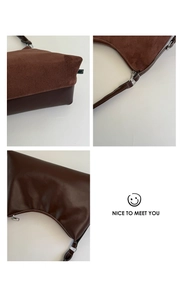 Vue détaillée des coutures en daim marron foncé et des surpiqûres blanches du sac à main